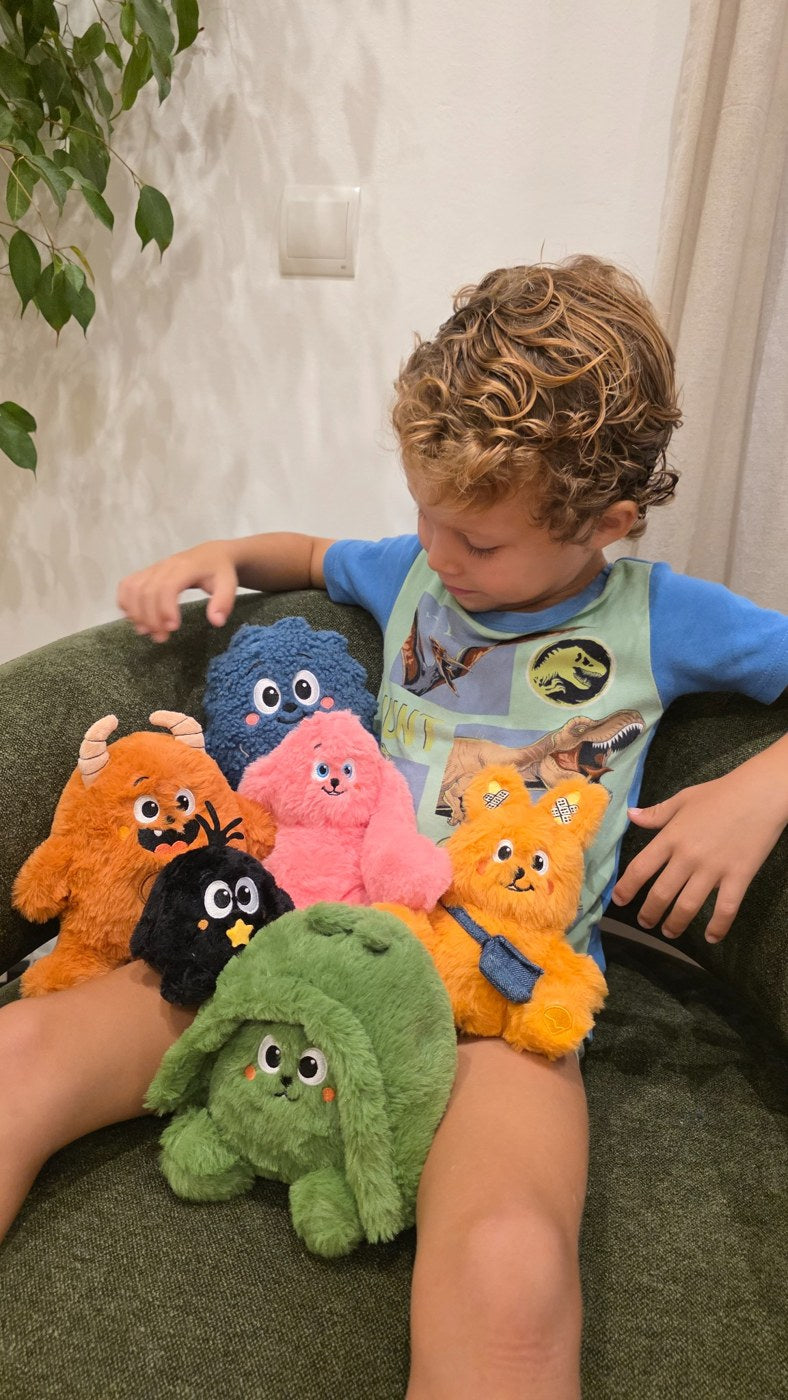A child holding the six My Inside World plush prototypes